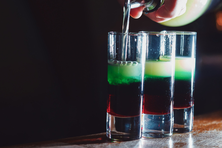 Preparation of shots cocktails. Close-upの写真素材