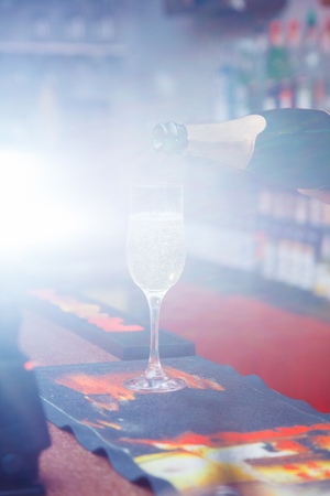 sparkling wine into glasses. champagneの写真素材