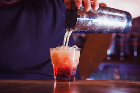 Preparation of long cocktails. Close-up