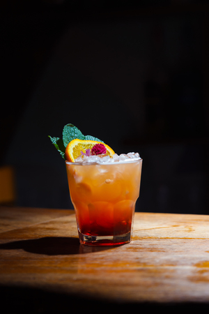 attractive tasty drink, with a bouquet of dried flowers, mint and orange. still life.の写真素材