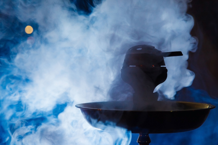 Beautiful smoke in the bowl of a hookah. close-upの写真素材