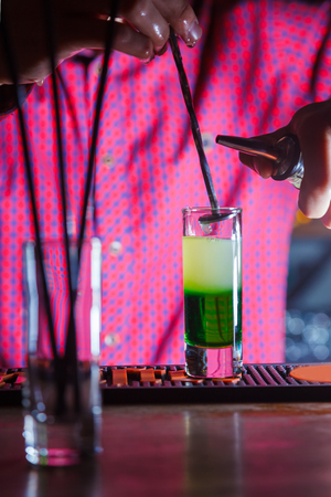 Cooking puffy shot cocktail green mexican at the bar counterの写真素材