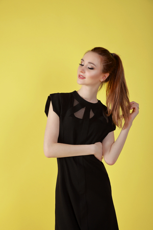Portrait of an attractive, cute girl in the studio.の写真素材