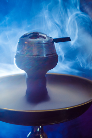 Beautiful smoke in the bowl of a hookah. close-up