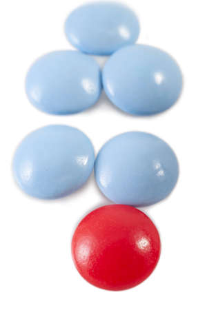 blue and red pills on white backgroundの写真素材