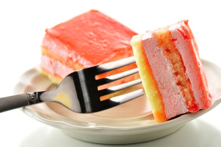 strawberry flavored layer cake on a fork 