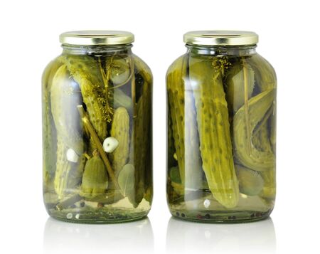 Glass jars with pickled cucumbers の写真素材