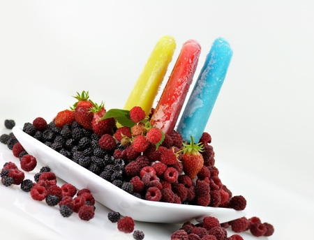 colorful ice cream pops with fresh raspberries and blackberries