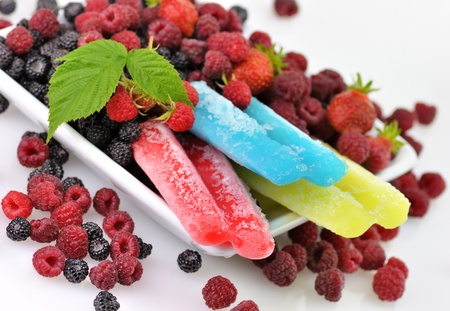 colorful ice cream pops with fresh raspberries and blackberries
