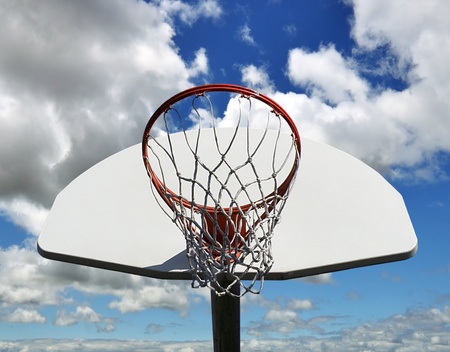 basketball hoop against a blue skyの写真素材