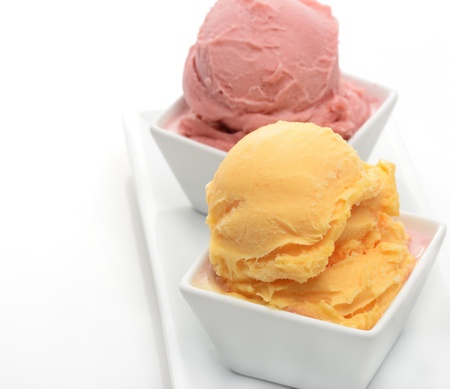 Orange And Strawberry Sorbet In The White Bowlsの写真素材