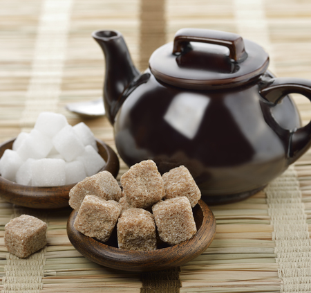 Brown And White Sugar And A Tea Potの写真素材
