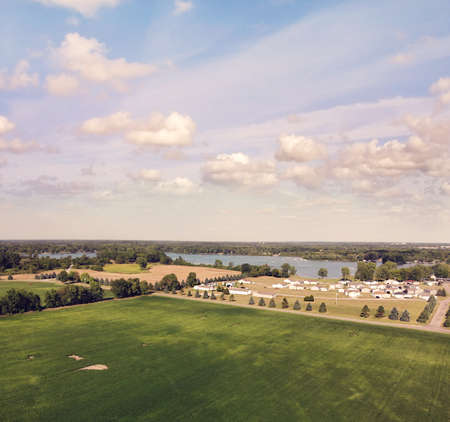 Countryside with residential buildings and lake view.
