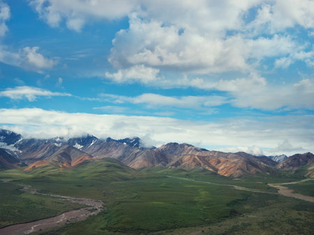 Beautiful Landscape with Snowy Mountains and Cloudy sky.