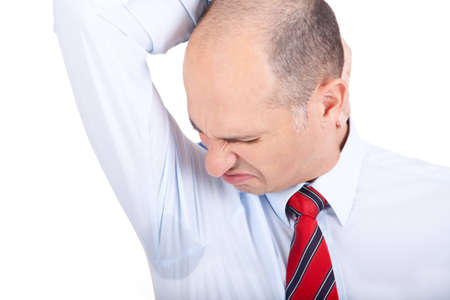 Business man notices a wet armpit