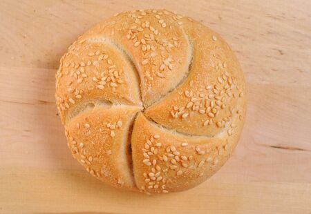 Bread and rolls on a cherry wood tableの写真素材