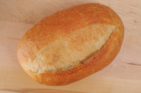 Bread and rolls on a cherry wood tableの写真素材