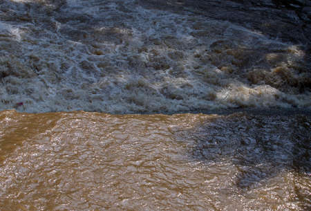 very dirty river flow close-upの写真素材