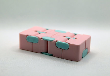 Pink and blue infinity cube with white backgroundの写真素材