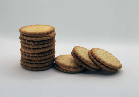 Group shoot of stacked biscuits isolated white background
