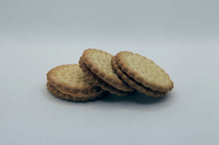 Group shoot of stacked biscuits isolated white backgroundの写真素材