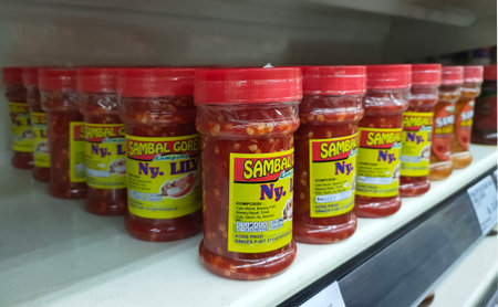 Jakarta, Indonesia-July 6, 2021: Rows of bottles of Lampung's fried chili sauce, Mrs. Lily on the supermarket shelfのeditorial素材