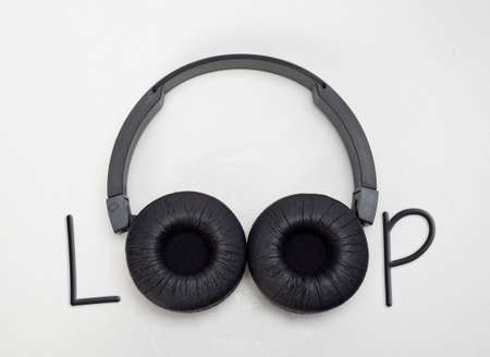 Loop writing using headphones instead of the letter o isolated white backgroundの写真素材