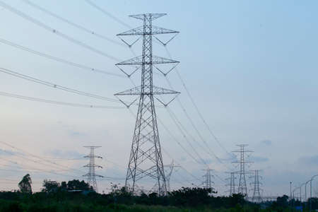 Low angle view of high voltage towerの写真素材