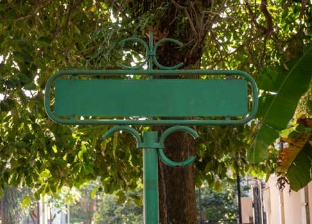 Empty street name sign.