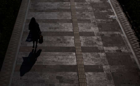 Jakarta, Indonesia-May 27, 2022: top view silhouette of people walking on the sidewalkのeditorial素材