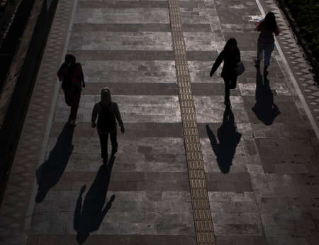 Jakarta, Indonesia-May 27, 2022: top view silhouette of people walking on the sidewalkのeditorial素材