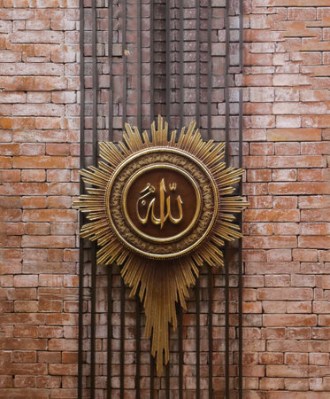 Gold medal on the brick wall. Religion concept.