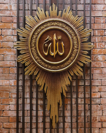 golden sign on the brick wall in the form of a shield