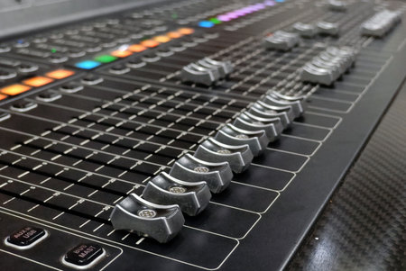 Audio mixing console with buttons close-up. Selective focus.