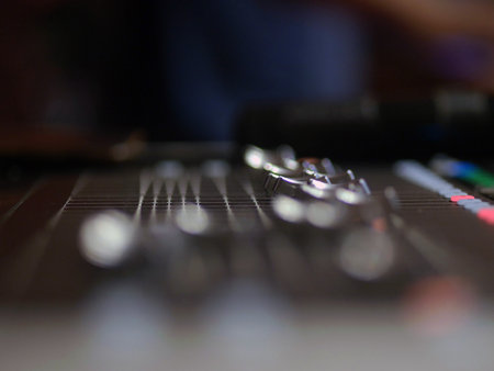 Sound mixer in the studio, close-up, soft focus.