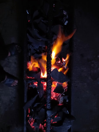 Burning coals in a blacksmith oven, close-up