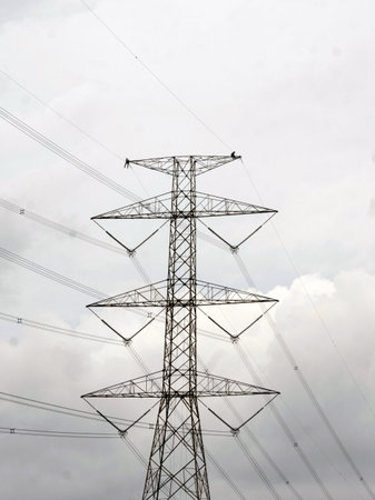 High voltage post. High-voltage tower on sky background.の写真素材