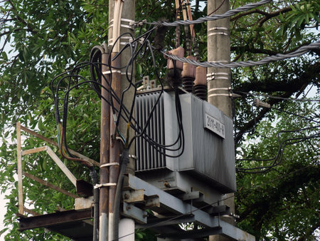 Electricity transformer on a pole in the city of Bangkok, Thailand.