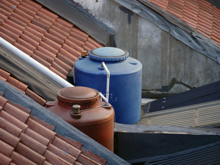 Water tank in the roof of a residential building, close-upの写真素材
