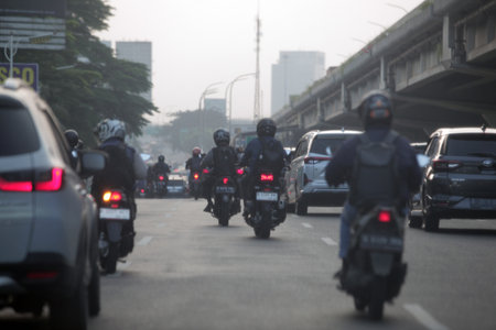Unidentified bikers on road in Bangkok,Thailand.の写真素材