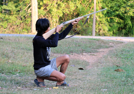 Hunter aiming and ready for shoot wild birds hunting