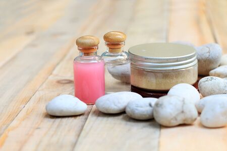 The scrub herbs with aroma oil on wooden blur backgroundの写真素材
