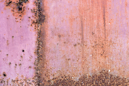 Metal plate covered with corrosion and old paint rusty grunge background