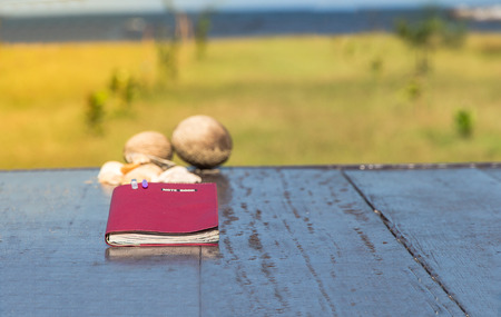 Diary,note book papers on wooden at beach background,seaの写真素材