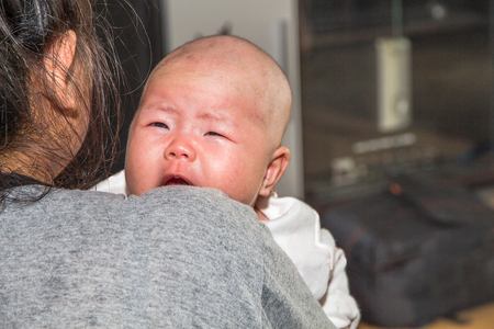 Cute New Born Baby with Mum Facial Gesture,cry,eat,sleepの写真素材