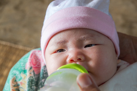 Cute New Born Baby with Mum Facial Gesture,cry,eat,sleepの写真素材
