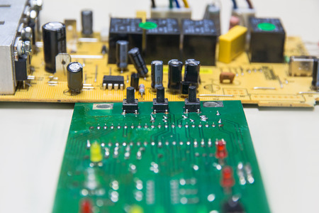Closeup on electronic board power supply,blurred and toned image,focus on the device