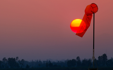 Windsock against on sun rise backgroundの写真素材