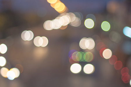 Abstract defocused lights bokeh as light car on road backgroundの写真素材
