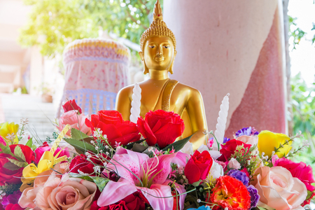 Rose fake flower and Floral with buddha background,rose flowers made of fabric,The fabric flowers bouquet,Colorful of decoration artificial flowerのeditorial素材